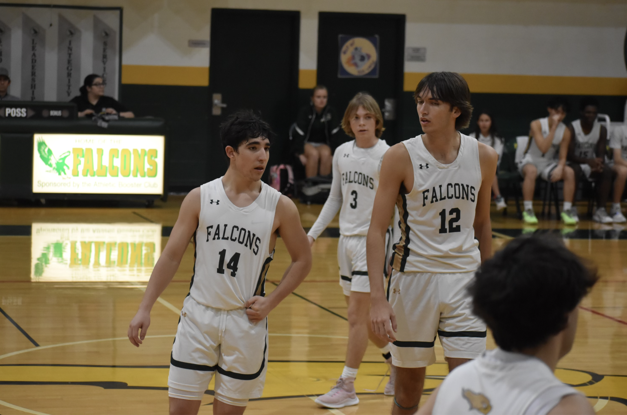 Boys basketball players Jackson Sisler, Jack Horne, and Nick Yatros during the Senior Night game against American Collegiate Academy. 